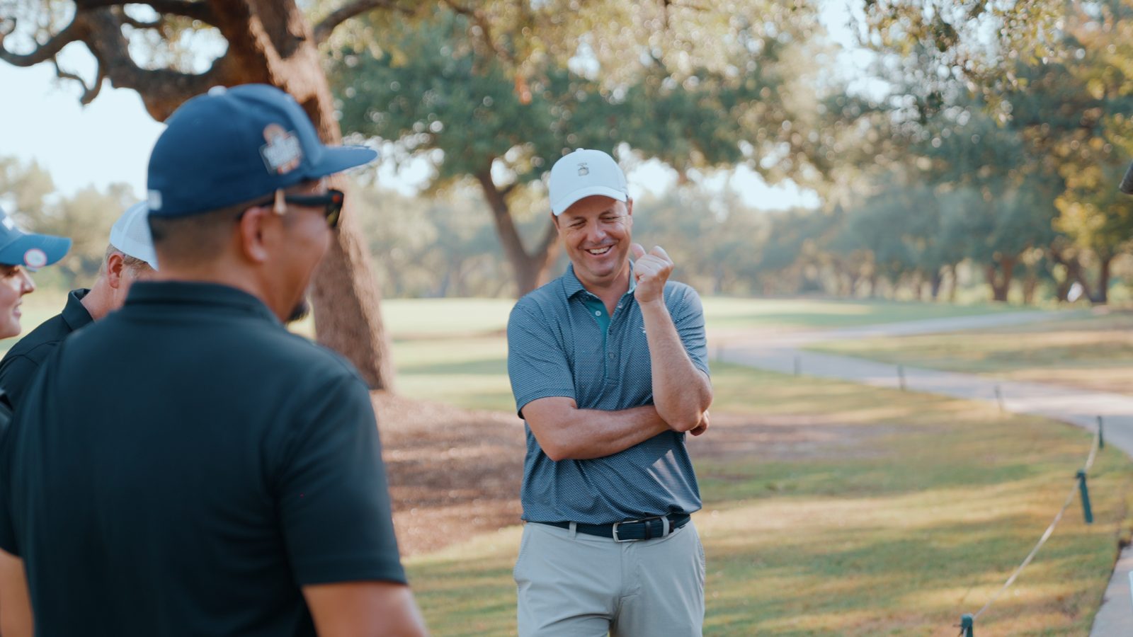 Two golfers talking on the course at Avery Ranch during the Datacloud golf day
