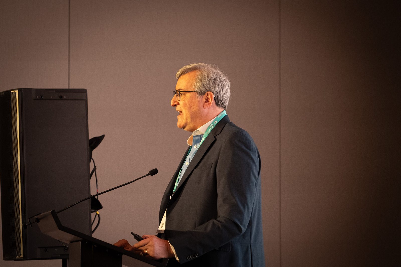 Keynote speaker at the podium on the Datacloud USA main stage
