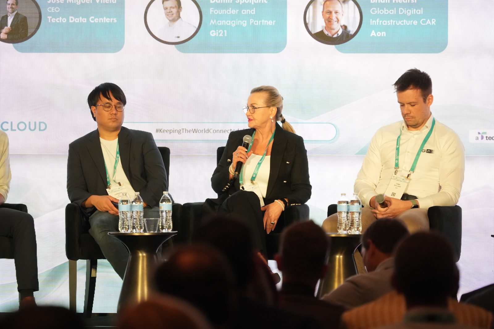 Speaker with microphone during a Datacloud USA panel